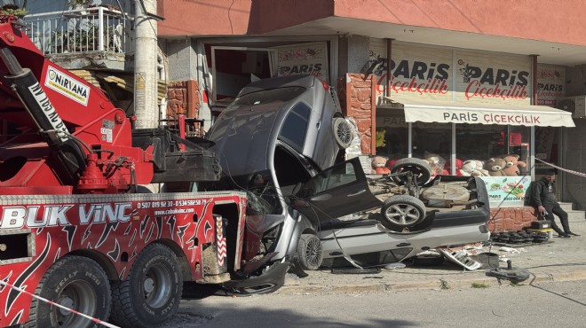 İzmir de freni boşalan vinç dehşet saçtı: Otomobilleri sürükleyip iş yerine girdi!